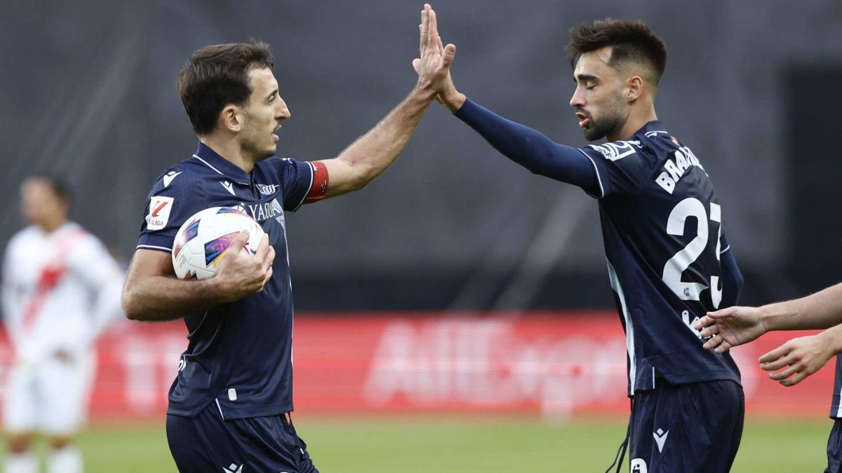 Brais Méndez and Mikel Oyarzabal celebrate a goal by Real Sociedad