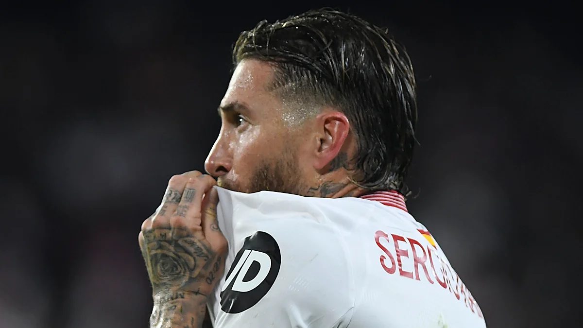 Sergio Ramos kisses the Sevilla badge after scoring a goal