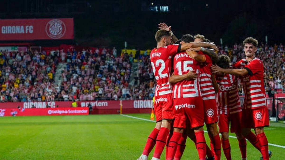 The Girona players celebrate a goal against Montilivi.