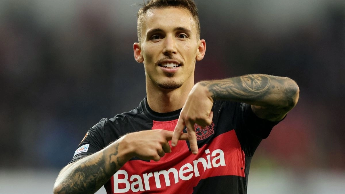 <p>Grimaldo celebrates a goal scored with Bayer Leverkusen</p>