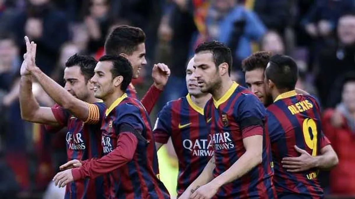 The players of Barcelona are celebrating an old goal.