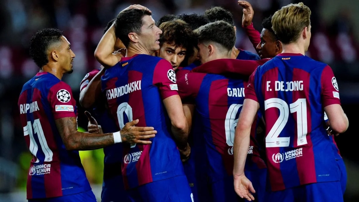 The Barcelona players celebrate a goal.