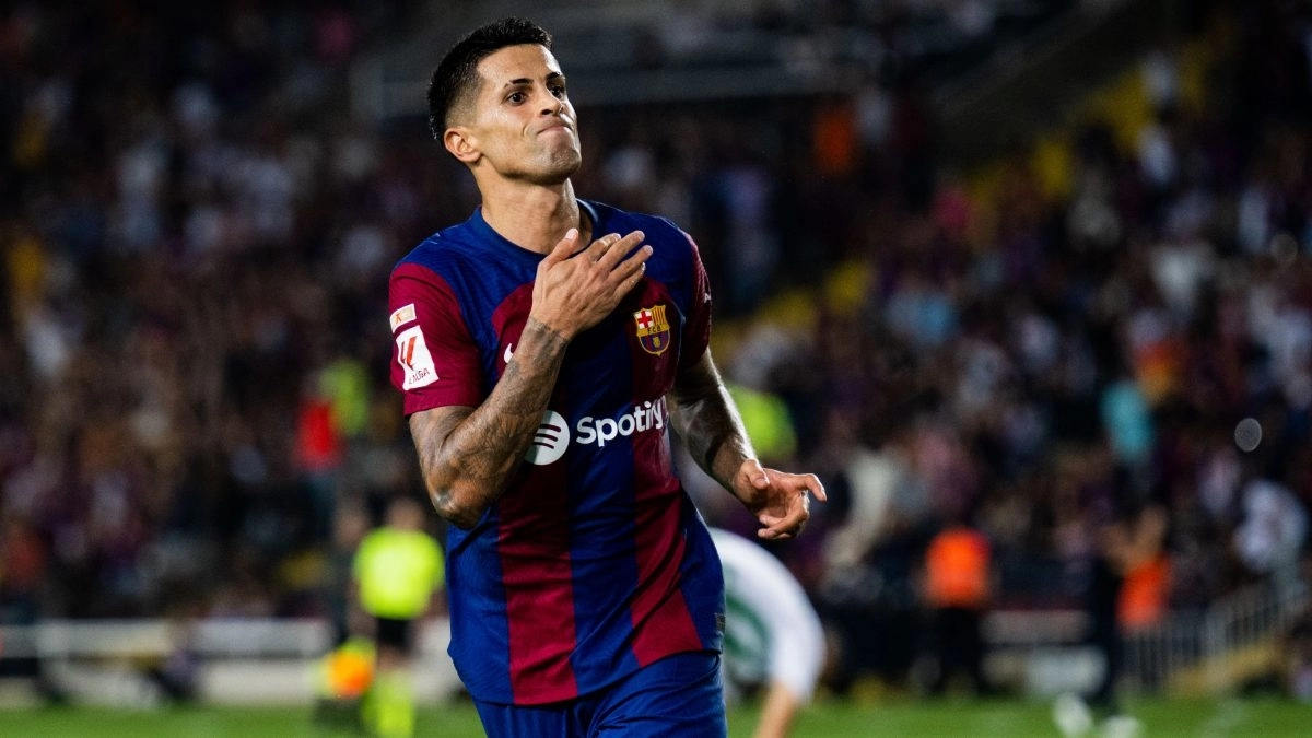 Joao Cancelo celebrates a goal scored with Barcelona