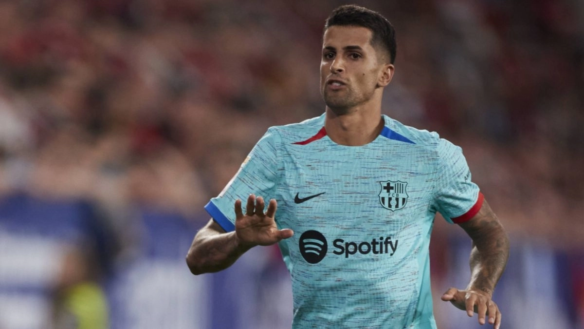 Joao Cancelo celebrates a goal scored with Barcelona.