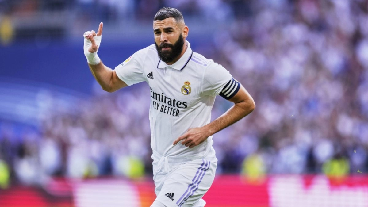 <p>Karim Benzema celebrates a goal with Real Madrid</p>