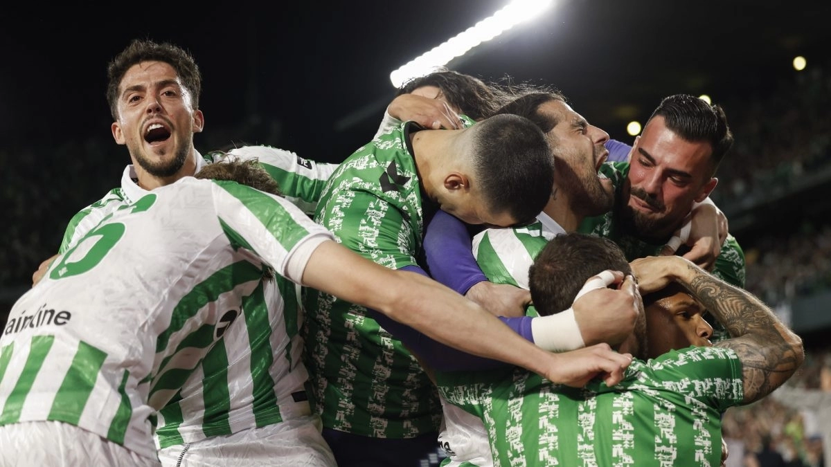 Real Betis players celebrate a goal.