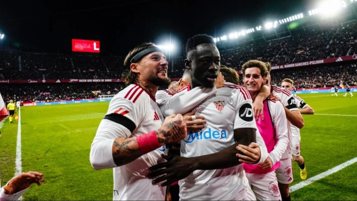 Sevilla players celebrate a goal.