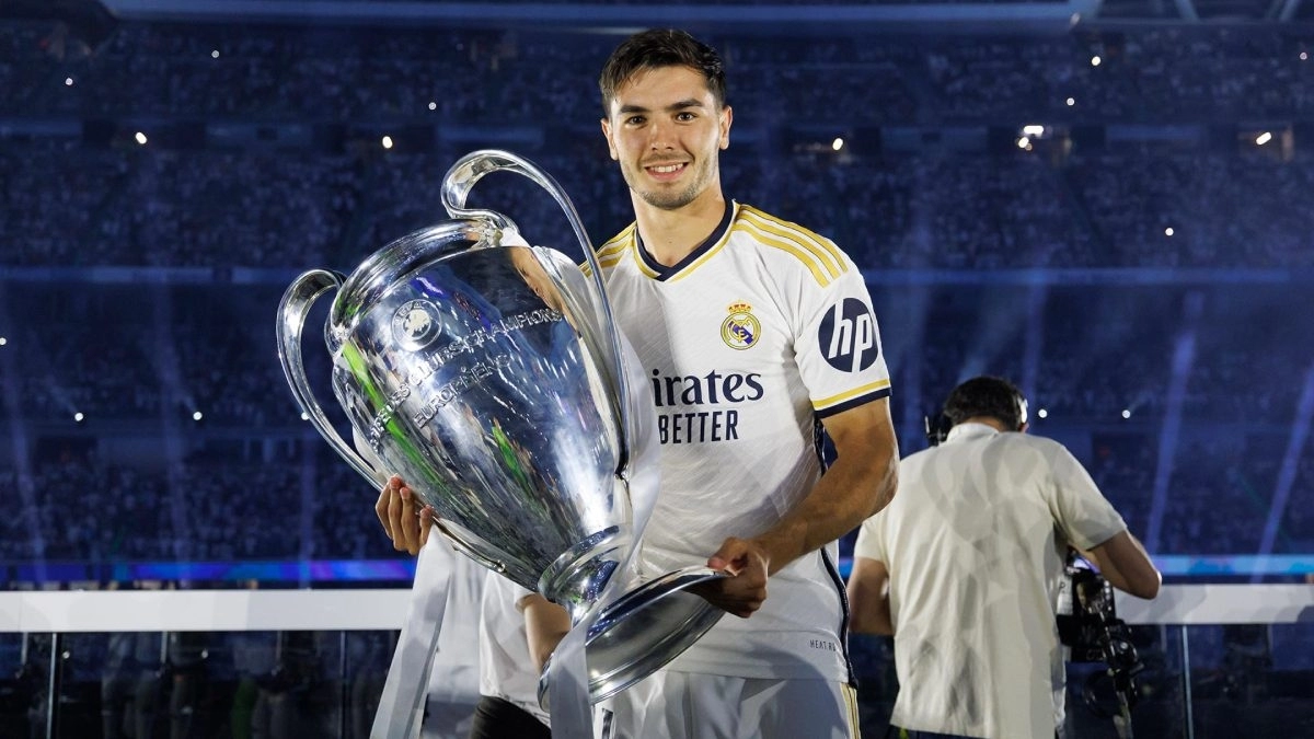 Brahim poses with the Champions League trophy