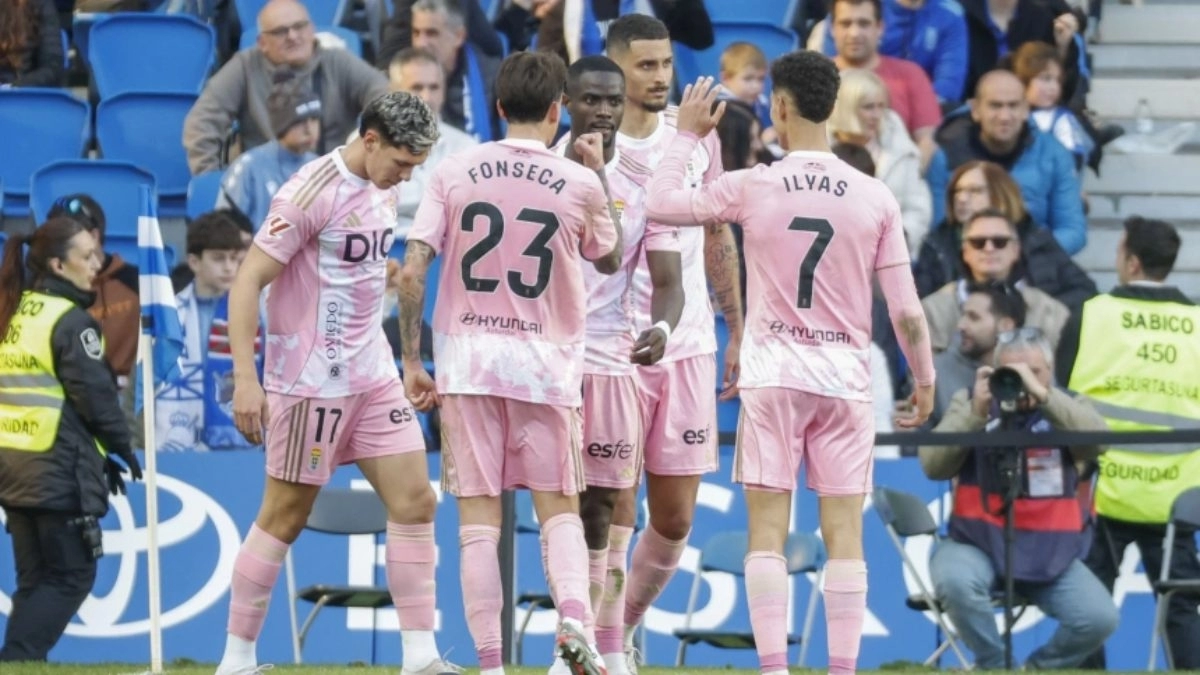 The Real Oviedo players celebrate a goal.